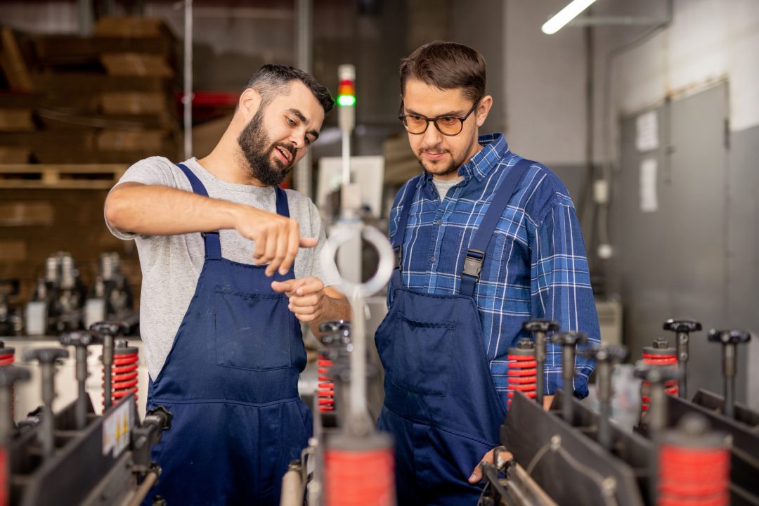 young-engineer-explaining-his-trainee-how-to-serve-and-use-technical-equipment.jpg